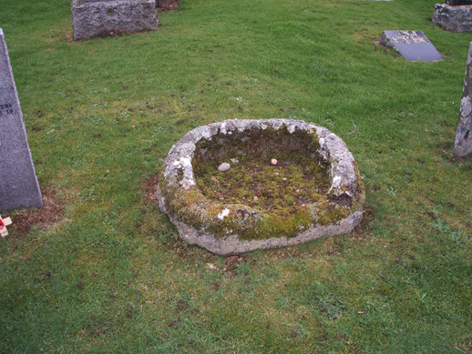 Photo of a possible ancient font in the churchyard at Abernethy.