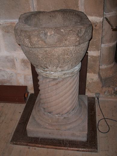 Photo of the very ancient font in Birnie Church.