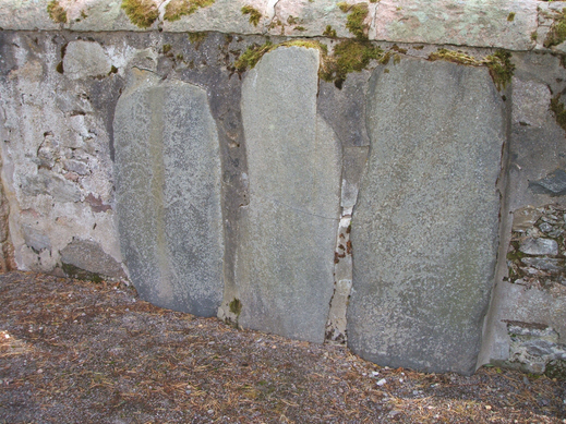 Picture of the symbol stones set into the wall of Knockando church yard