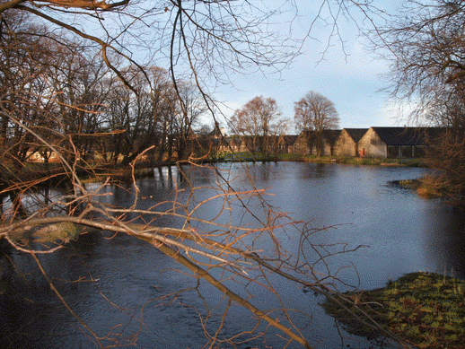 Photograph of the distillery resevoir under which the old chapel at Longmorn was situated.