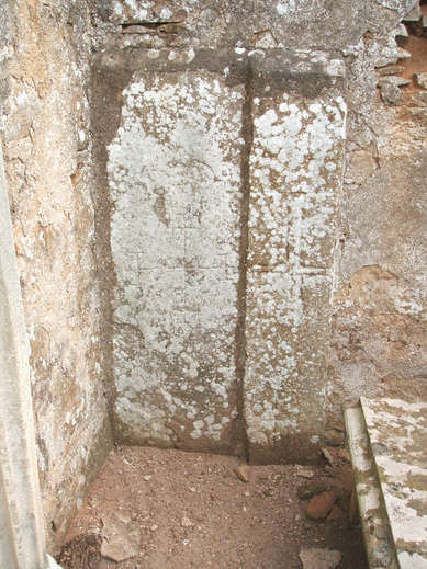 Old tombstones set into the interior wall of the Leslie of Findrassie mausoleum at Spynie churchyard.